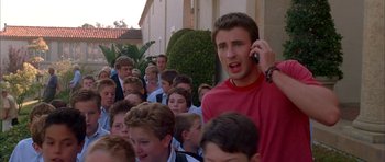Movie still from “Cellular” (2004), directed by David R. Ellis – A group of people that are standing in the street; Medium shot, High angle