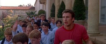 Movie still from “Cellular” (2004), directed by David R. Ellis – A large group of young men standing next to each other; Medium shot, High angle