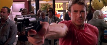 Movie still from “Cellular” (2004), directed by David R. Ellis – A man holding a video game controller in his hand; Close Up shot, Low angle