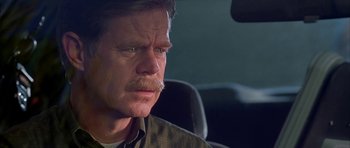 Movie still from “Cellular” (2004), directed by David R. Ellis – A person sitting in a car; Close Up shot, Over the shoulder angle