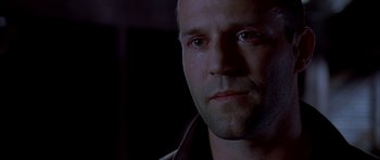Movie still from “Cellular” (2004), directed by David R. Ellis – A man's face in the dark; Close Up shot, Low angle