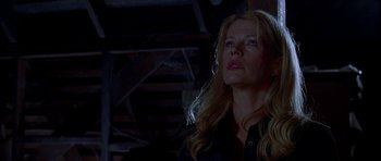 Movie still from “Cellular” (2004), directed by David R. Ellis – A woman with long blonde hair looking up at the sky; Close Up shot, Low angle