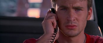 Movie still from “Cellular” (2004), directed by David R. Ellis – A person talking on a cell phone; Close Up shot, Low angle