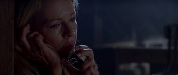 Movie still from “Cellular” (2004), directed by David R. Ellis – A woman holding a phone up to her ear; Close Up shot, Low angle