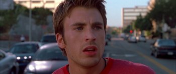 Movie still from “Cellular” (2004), directed by David R. Ellis – A person wearing a red t - shirt; Close Up shot, Low angle