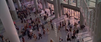Movie still from “Cellular” (2004), directed by David R. Ellis – A large group of people walking in an airport terminal; Extreme Wide shot, High angle