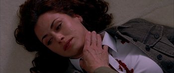 Movie still from “Cellular” (2004), directed by David R. Ellis – A woman is laying on the ground with blood all over her neck; Close Up shot, Overhead angle