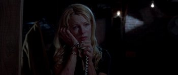 Movie still from “Cellular” (2004), directed by David R. Ellis – A woman holding a phone up to her ear; Close Up shot, Low angle