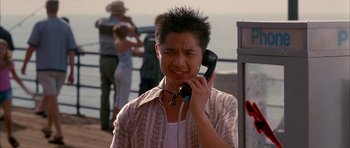 Movie still from “Cellular” (2004), directed by David R. Ellis – A man on the phone on the beach; Close Up shot, High angle