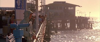 Movie still from “Cellular” (2004), directed by David R. Ellis – A group of people standing on a pier near the water; Wide shot, Low angle