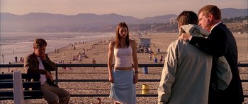 Movie still from “Cellular” (2004), directed by David R. Ellis – A woman standing on a beach near the ocean; Medium shot, Low angle