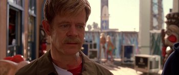 Movie still from “Cellular” (2004), directed by David R. Ellis – A person with a beard and mustache; Close Up shot, Over the shoulder angle