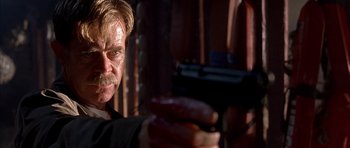 Movie still from “Cellular” (2004), directed by David R. Ellis – A person holding a gun; Close Up shot, Low angle