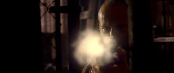 Movie still from “Cellular” (2004), directed by David R. Ellis – A man with a beard is holding a smoke bomb; Close Up shot, Low angle