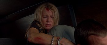Movie still from “Cellular” (2004), directed by David R. Ellis – A woman with blood all over her face and arm; Close Up shot, Low angle