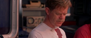 Movie still from “Cellular” (2004), directed by David R. Ellis – A man in a white shirt and a red neck tie; Close Up shot, Over the shoulder angle