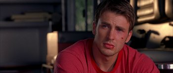 Movie still from “Cellular” (2004), directed by David R. Ellis – A person with a red shirt on; Close Up shot, Over the shoulder angle