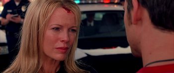 Movie still from “Cellular” (2004), directed by David R. Ellis – A woman in a black shirt with blood on her face; Close Up shot, Low angle