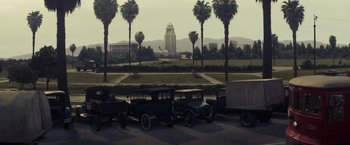 Movie still from “Changeling” (2008), directed by Clint Eastwood – An image of an old car parked on the side of the road; Extreme Wide shot, High angle