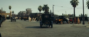 Movie still from “Changeling” (2008), directed by Clint Eastwood – An old car is driving down the street; Extreme Wide shot, High angle
