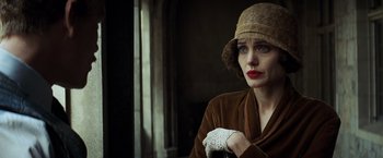 Movie still from “Changeling” (2008), directed by Clint Eastwood – A woman in a brown coat and a brown hat; Close Up shot, Low angle