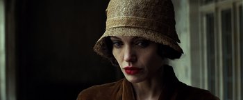 Movie still from “Changeling” (2008), directed by Clint Eastwood – A person wearing a hat; Close Up shot, Low angle