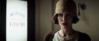 Movie still from “Changeling” (2008), directed by Clint Eastwood – A person wearing a hat; Close Up shot, Low angle