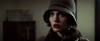 Movie still from “Changeling” (2008), directed by Clint Eastwood – A person wearing a hat; Close Up shot, Low angle