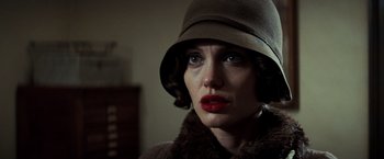 Movie still from “Changeling” (2008), directed by Clint Eastwood – A person wearing a hat; Close Up shot, Low angle