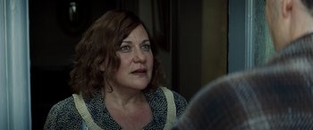 Movie still from “Changeling” (2008), directed by Clint Eastwood – A person looking at the camera; Close Up shot, Over the shoulder angle