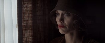 Movie still from “Changeling” (2008), directed by Clint Eastwood – A person wearing a hat; Close Up shot, Low angle