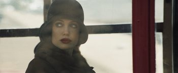 Movie still from “Changeling” (2008), directed by Clint Eastwood – A person wearing a hat and a fur coat; Close Up shot, Low angle