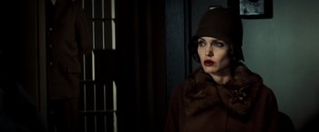 Movie still from “Changeling” (2008), directed by Clint Eastwood – A woman in a brown coat and a fur hat; Close Up shot, Low angle