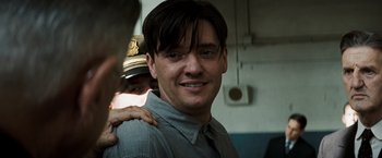 Movie still from “Changeling” (2008), directed by Clint Eastwood – A person with his arms around another person; Close Up shot, Over the shoulder angle