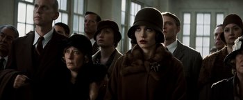 Movie still from “Changeling” (2008), directed by Clint Eastwood – A group of people standing in front of a window; Close Up shot, Low angle