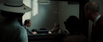 Movie still from “Changeling” (2008), directed by Clint Eastwood – A man and a woman sitting in front of a mirror; Medium shot, Over the shoulder angle