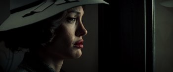 Movie still from “Changeling” (2008), directed by Clint Eastwood – A person wearing a hat; Close Up shot, Low angle