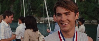 Movie still from “Charlie St. Cloud” (2010), directed by Burr Steers – A young man smiling for the camera; Close Up shot, Over the shoulder angle