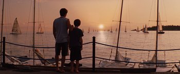 Movie still from “Charlie St. Cloud” (2010), directed by Burr Steers – Two people standing next to a body of water; Wide shot, Over the shoulder angle