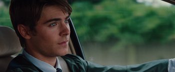 Movie still from “Charlie St. Cloud” (2010), directed by Burr Steers – A person sitting in a car looking out the window; Close Up shot, Over the shoulder angle