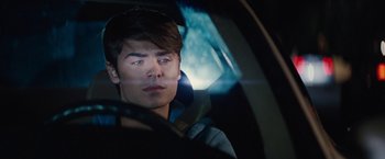 Movie still from “Charlie St. Cloud” (2010), directed by Burr Steers – A man sitting in the driver's seat of a car; Close Up shot, Over the shoulder angle