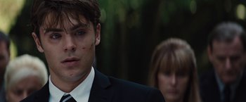 Movie still from “Charlie St. Cloud” (2010), directed by Burr Steers – A man in a black suit and a woman in a black suit; Close Up shot, Over the shoulder angle
