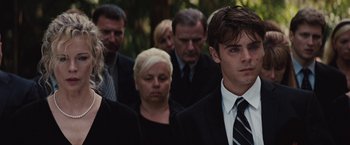 Movie still from “Charlie St. Cloud” (2010), directed by Burr Steers – A group of people in black suits and ties; Close Up shot, Over the shoulder angle