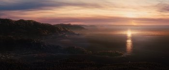 Movie still from “Charlie St. Cloud” (2010), directed by Burr Steers – A view of a mountain range with a sunset in the background; Extreme Wide shot, High angle