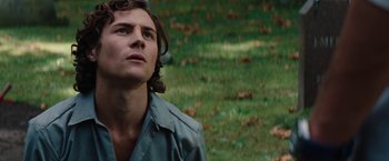 Movie still from “Charlie St. Cloud” (2010), directed by Burr Steers – A young man looking up into the sky while standing in a field; Close Up shot, Low angle