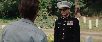 Movie still from “Charlie St. Cloud” (2010), directed by Burr Steers – A man in a uniform talking to another man; Medium shot, Over the shoulder angle