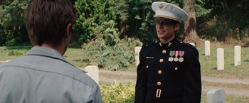 Movie still from “Charlie St. Cloud” (2010), directed by Burr Steers – A woman in a military uniform standing next to a man; Medium shot, Over the shoulder angle