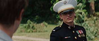 Movie still from “Charlie St. Cloud” (2010), directed by Burr Steers – A man in a military uniform stands in front of some trees; Close Up shot, Low angle