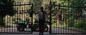 Movie still from “Charlie St. Cloud” (2010), directed by Burr Steers – A woman standing at the gate to enter a forest; Wide shot, Low angle