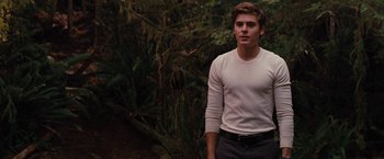 Movie still from “Charlie St. Cloud” (2010), directed by Burr Steers – A young man standing in front of a tree; Medium shot, Over the shoulder angle